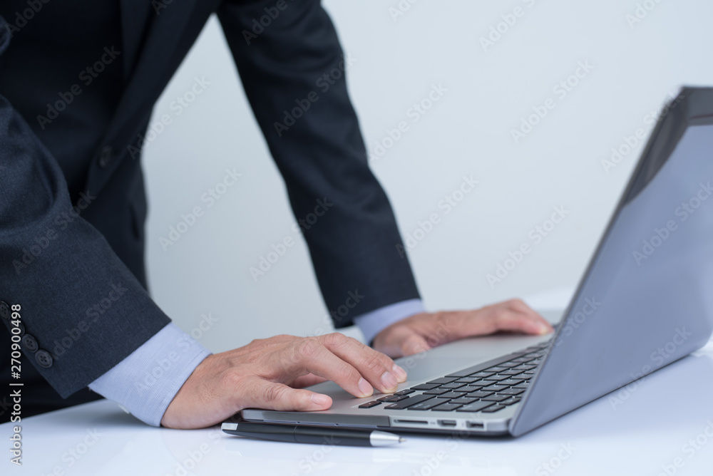 Businessman working on laptop computer Businessman working on laptop computer