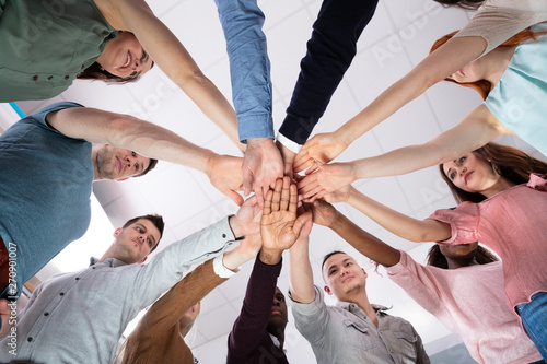 Foto Low Angle View Of People Stacking Hand