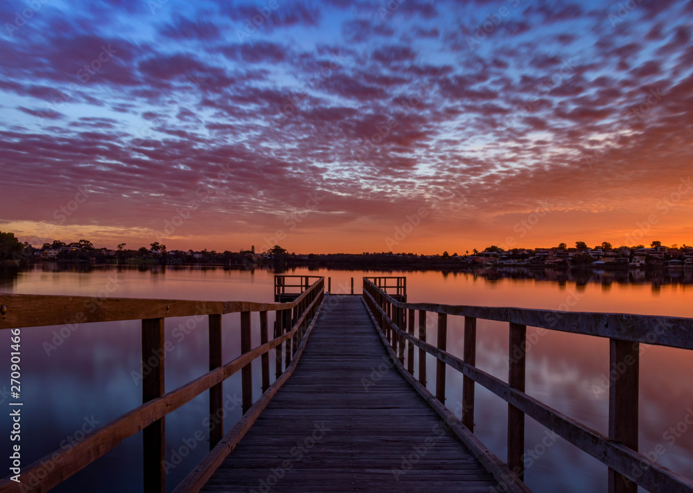 Looking down the Jetty, with a colorful Sky at Sunset in Perth Australia