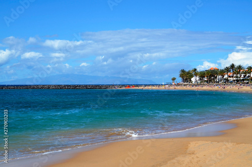 Fototapeta Naklejka Na Ścianę i Meble -  View of Playa del Camison beach with turquoise water and yellow sand in Las Americas, Tenerife,Canary Islands,Spain.Summer vacation or travel concept.