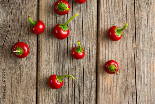 cherry peppers on weathered wooden table