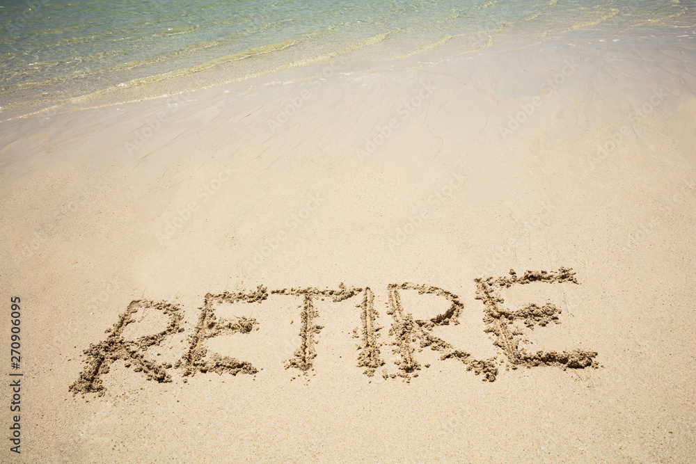 Fototapeta premium Retire Text On Sand Beach