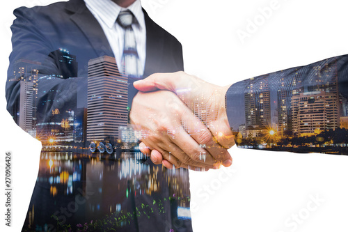 The double exposure handshake businees and city photo