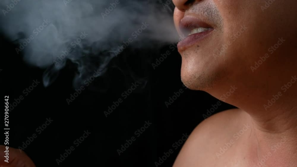 A man holding cigarette. Nicotine destroy teeth and gum healthy. it make effect Yellow stain, Tooth decay and Bad breath. world no tobacoo day. A man holding cigarette. Nicotine destroy teeth and gum healthy. it make effect Yellow stain, Tooth decay and Bad breath. world no tobacoo day.