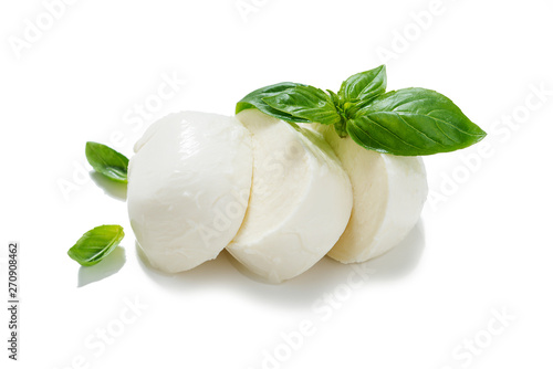 Traditional Italian Mozzarella cheese and basil on white background .