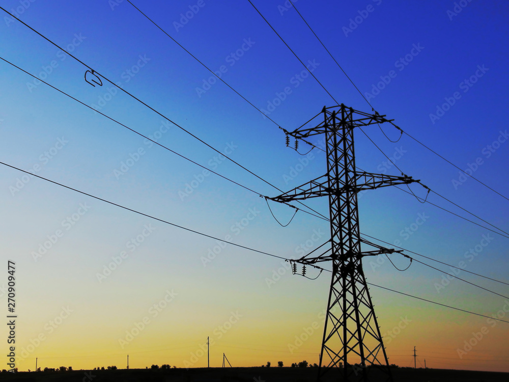 Fototapeta premium high voltage power transmission line at sunset