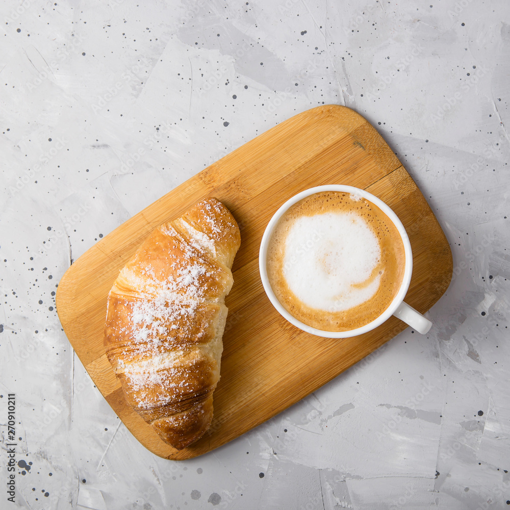 Φωτογραφία Beautiful and simple traditional French breakfast of fresh croissant and a cup o