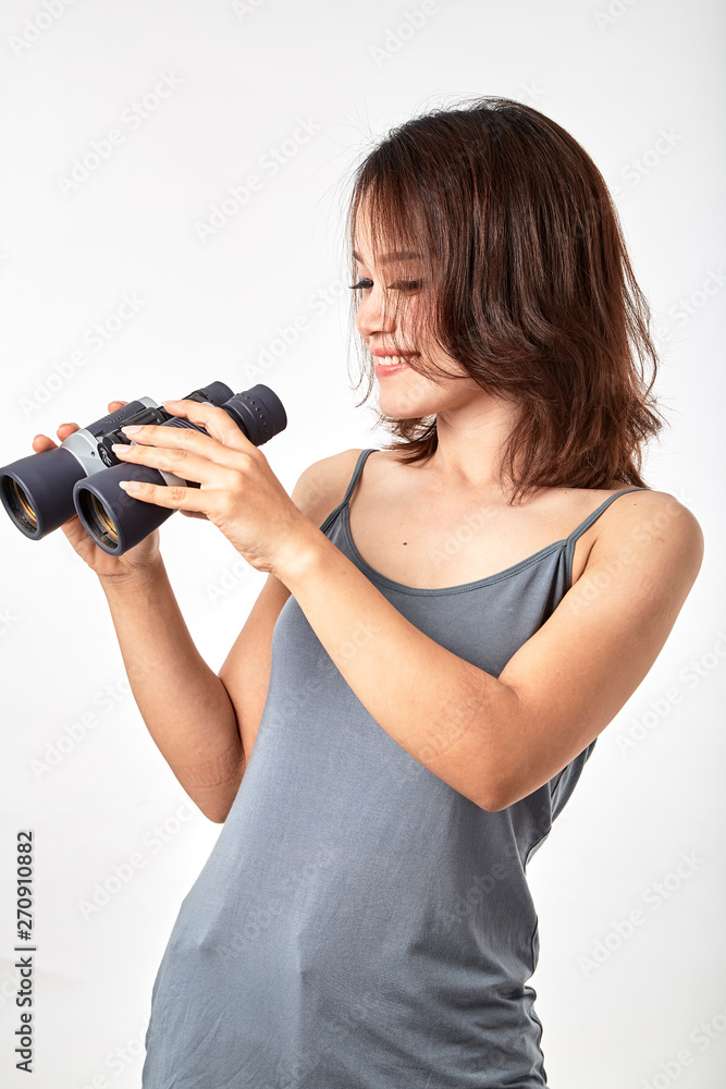 Young Asian woman with binoculars Young Asian woman with binoculars