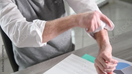 Businessman rolling up his sleeves
