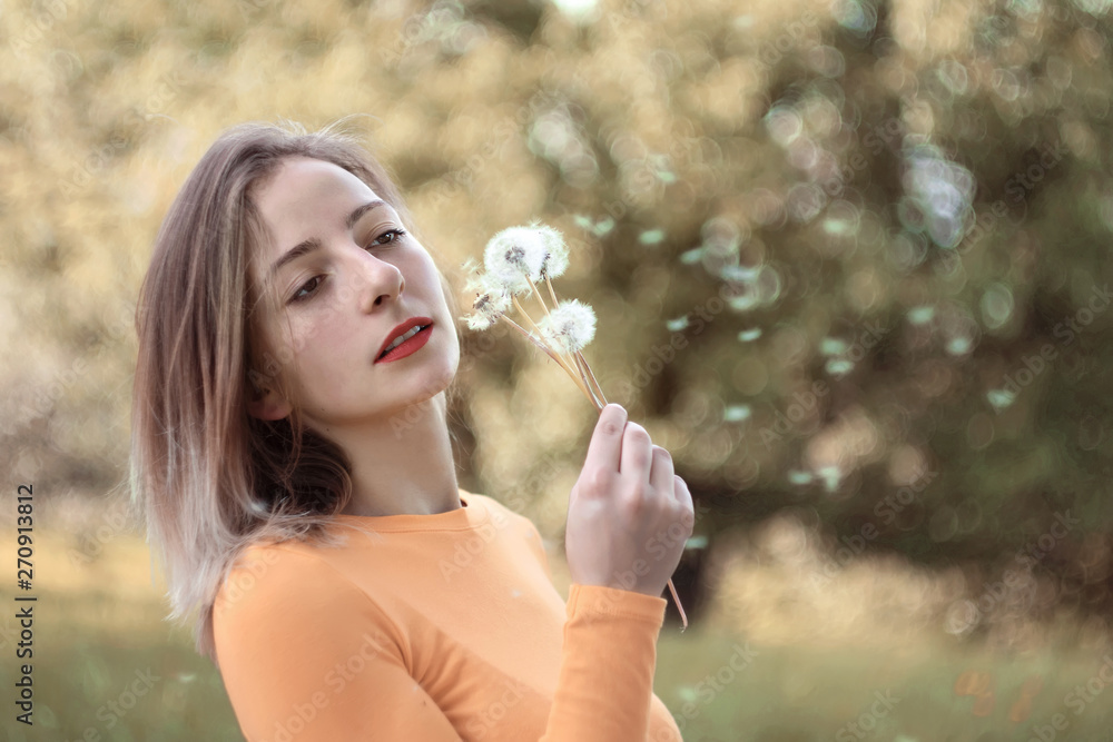 Portrait of a young woman with dandelions Portrait of a young woman with dandelions