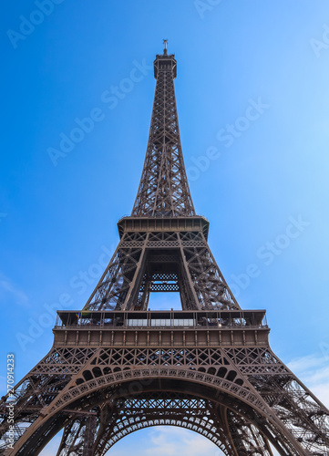 Eiffel Tower in Paris France against blue sky. April 2019
