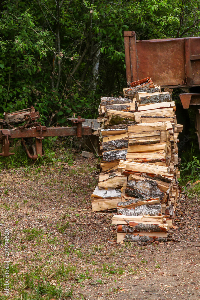 pile crushed birch logs high pile on the ground against a rusty trunk lorry truck background pile crushed birch logs high pile on the ground against a rusty trunk lorry truck background