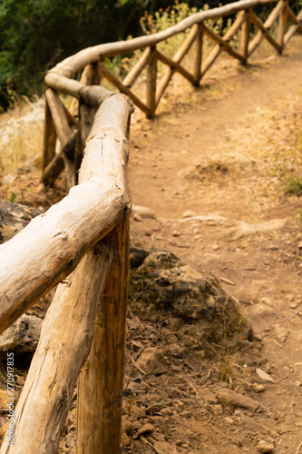 vertical photo wooden fences providing security in the mountains walk in the gorge