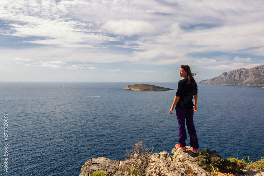 Young woman enjoying beautiful view. Kalymnos Island, Greece.