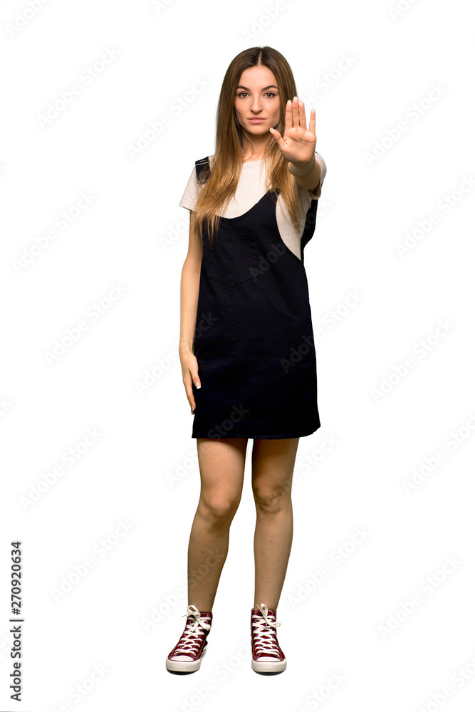 Full body Young pretty woman making stop gesture denying a situation that thinks wrong on isolated background Full body Young pretty woman making stop gesture denying a situation that thinks wrong on isolated background