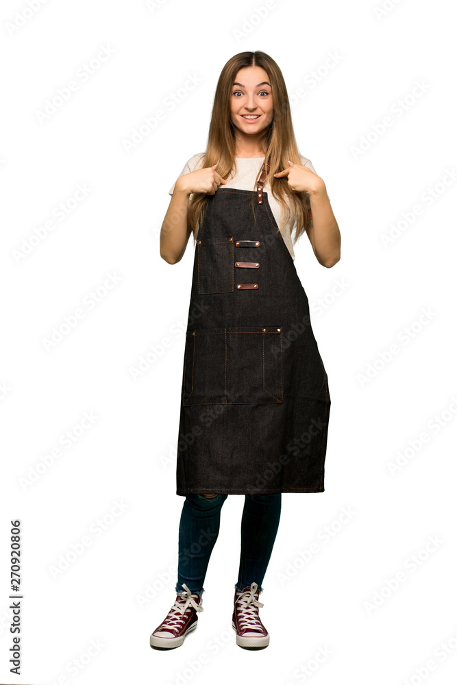 Fototapeta premium Full body Young woman with apron with surprise facial expression on isolated background