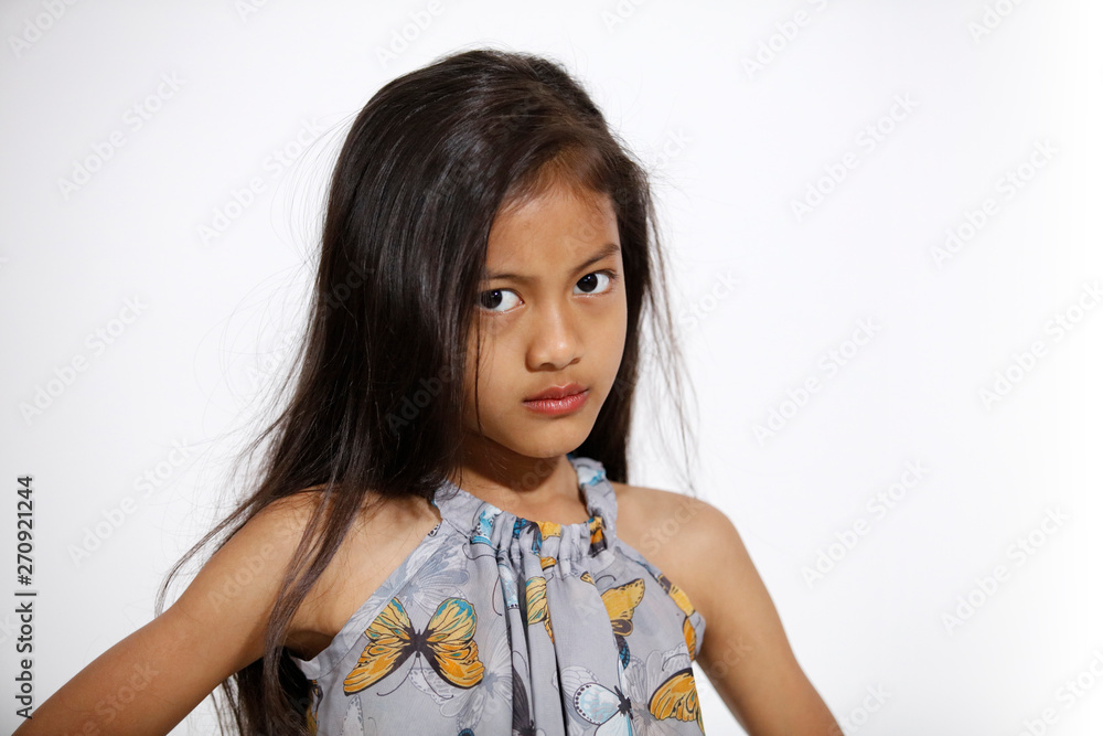 Pretty asian girl in butterflies dress is serious Pretty asian girl in butterflies dress is serious