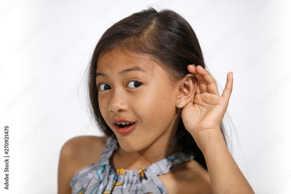 Pretty asian girl in butterflies dress tries to listen Pretty asian girl in butterflies dress tries to listen