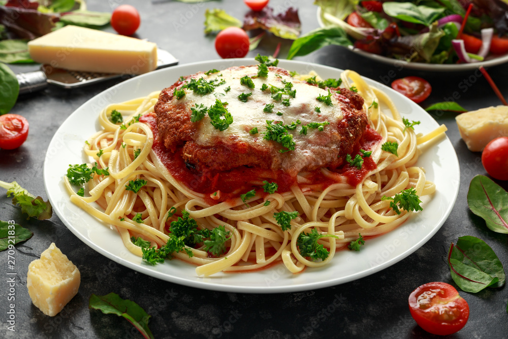 Chicken Parmesan with Cheese and Marinara Sauce served over spaghetti, pasta Chicken Parmesan with Cheese and Marinara Sauce served over spaghetti, pasta