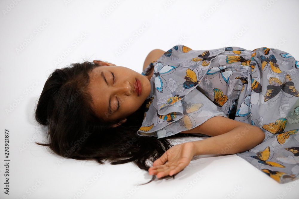 Pretty asian girl in gray blue butterflies dress sleeps - obrazy, fototapety, plakaty 