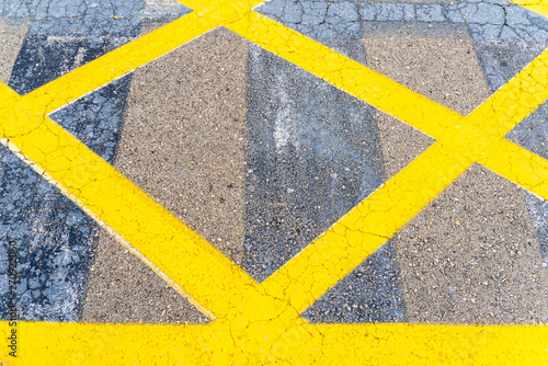 Bright and thick yellow lines on the floor of a parking lot. © Joaquin Corbalan