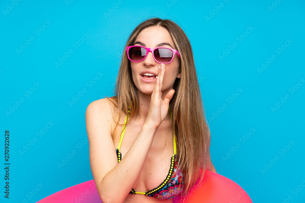 Young woman in bikini in summer holidays whispering something Young woman in bikini in summer holidays whispering something
