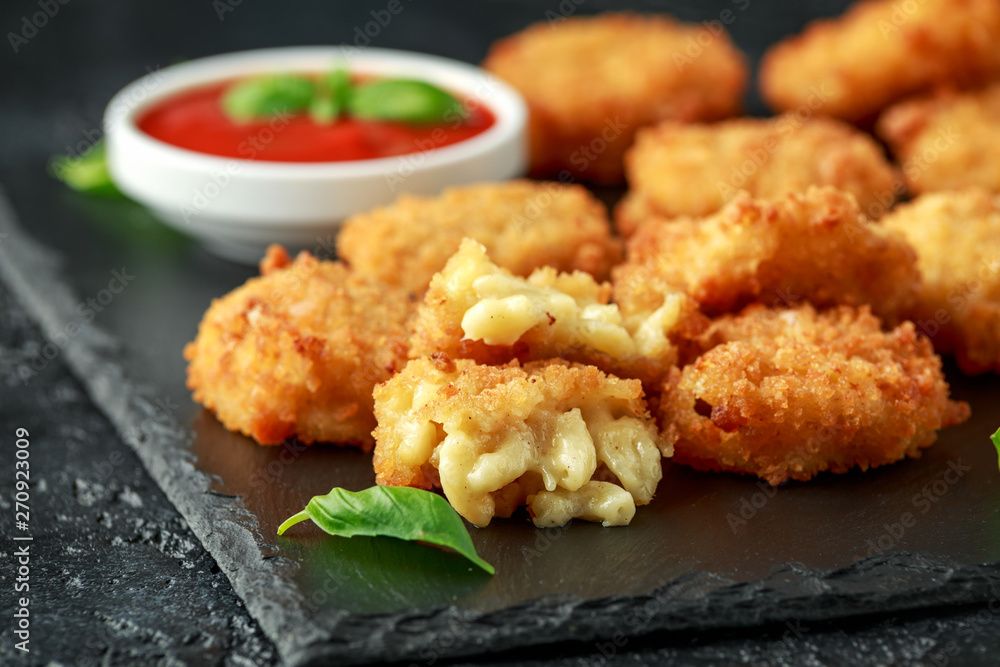 Fried Mac, macaroni and Cheese Bites in breadcrumbs with ketchup sauce Fried Mac, macaroni and Cheese Bites in breadcrumbs with ketchup sauce