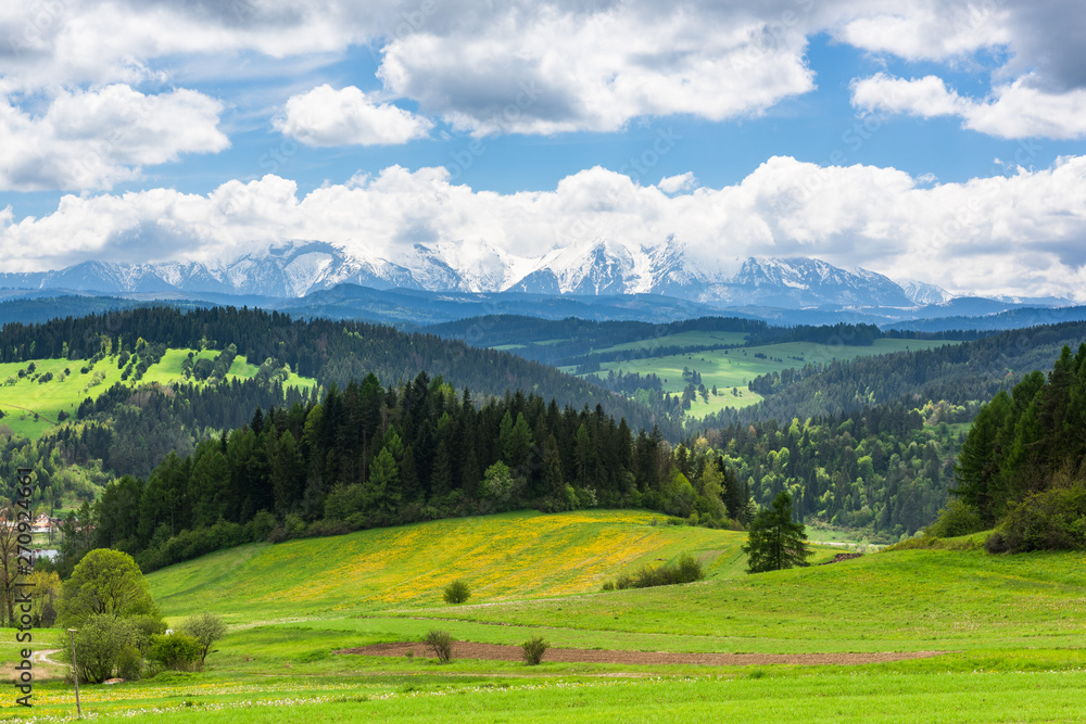 Amazing view over hills and meadows with tatra Mountains on horizon, Poland