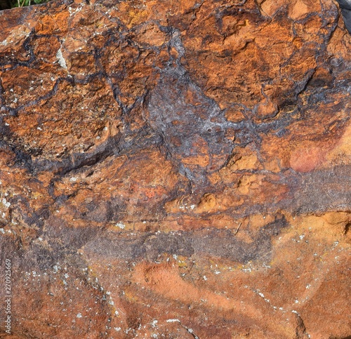 orange sandstone with darker veins