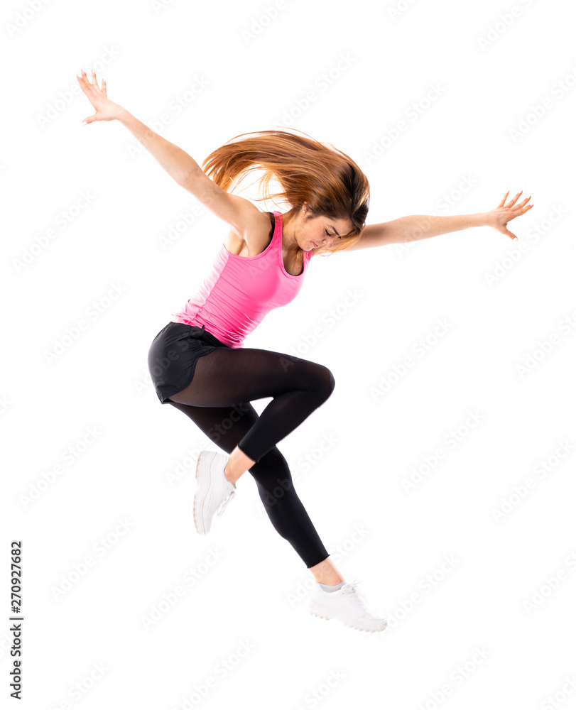 Young dance girl over isolated white background jumping