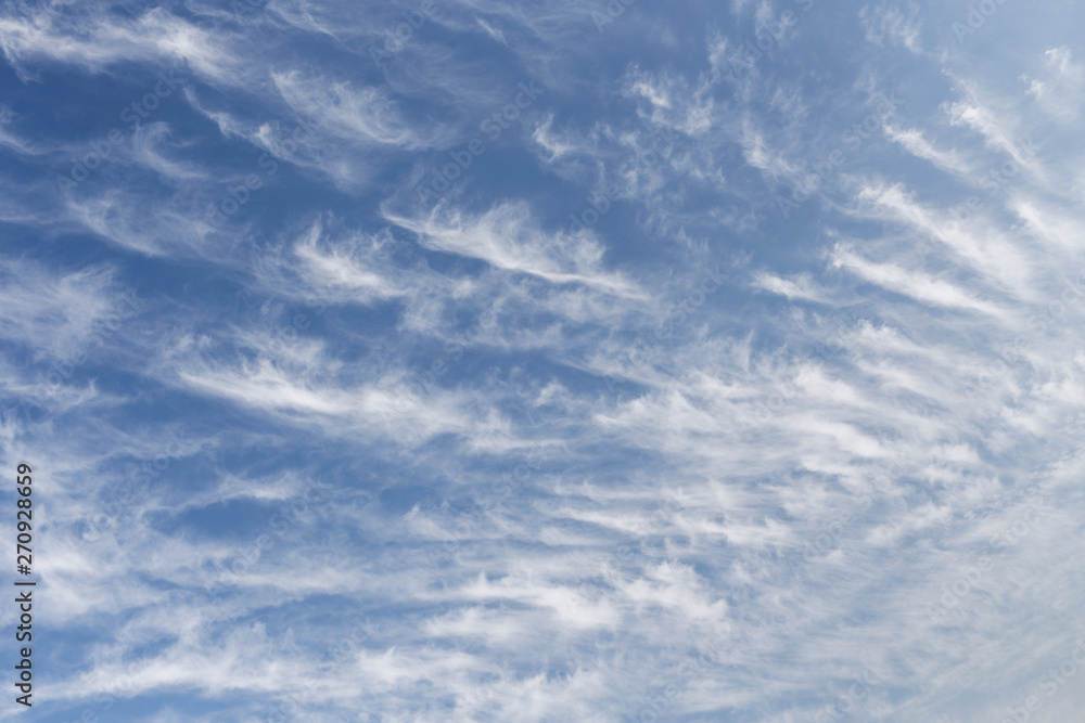 Beautiful cirrus clouds. Blue sky with beautiful clouds. Sky background Beautiful cirrus clouds. Blue sky with beautiful clouds. Sky background