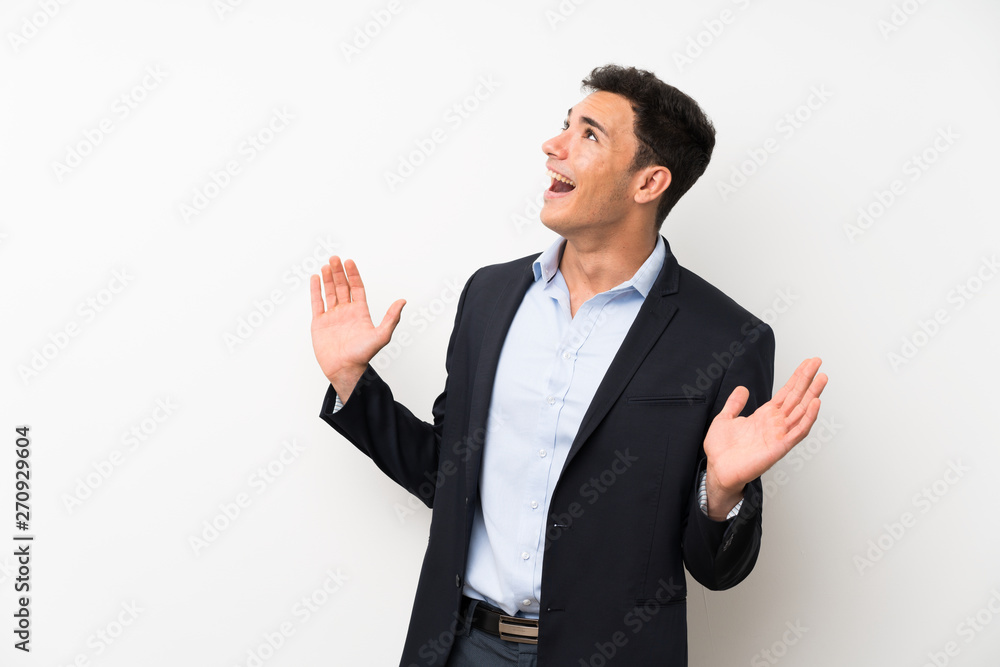 Handsome man over isolated white wall with surprise facial expression Handsome man over isolated white wall with surprise facial expression