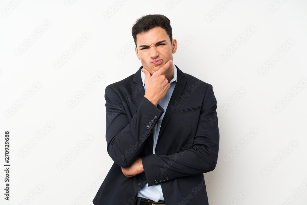 Handsome man over isolated white wall thinking an idea Handsome man over isolated white wall thinking an idea