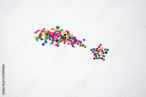 falling star from shining confetti on white background