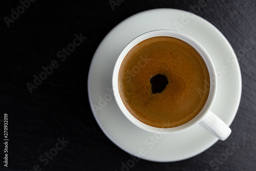 View from above of a delicious and tasty cup of freshly made coffee