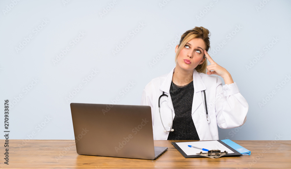 Blonde doctor woman with problems making suicide gesture Blonde doctor woman with problems making suicide gesture