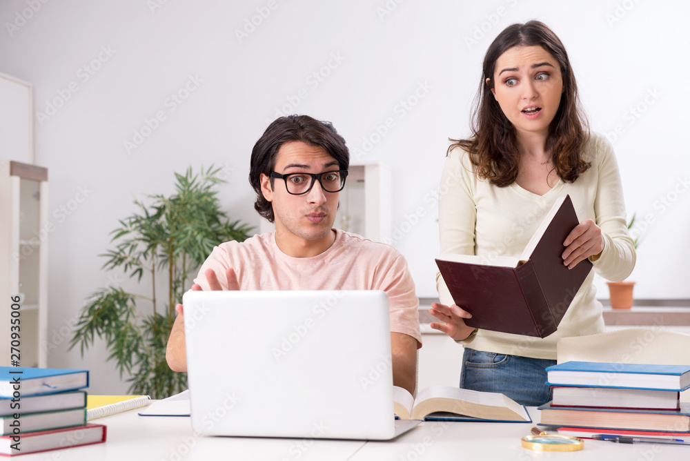 Students preparing for exam together at home Students preparing for exam together at home