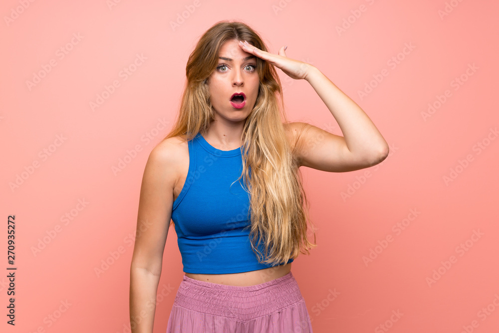 Young blonde woman over isolated pink background has just realized something and has intending the solution Young blonde woman over isolated pink background has just realized something and has intending the solution