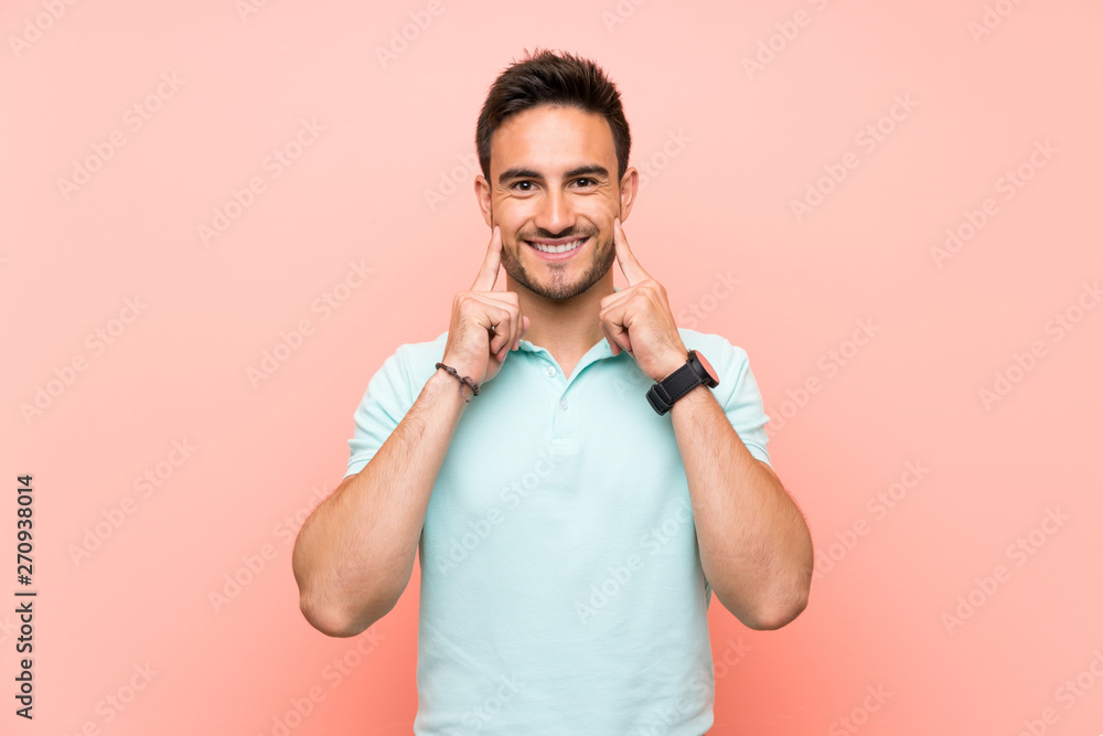 Handsome young man over isolated background smiling with a happy and pleasant expression Handsome young man over isolated background smiling with a happy and pleasant expression