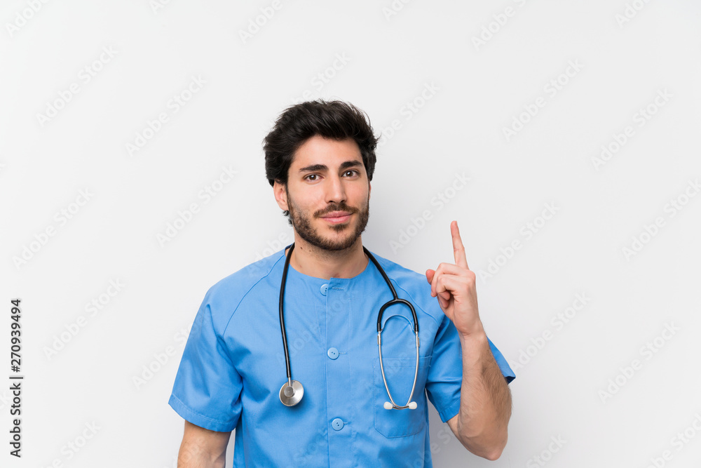 Surgeon doctor man over isolated white wall pointing with the index finger a great idea Surgeon doctor man over isolated white wall pointing with the index finger a great idea