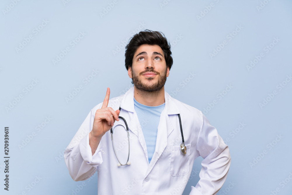 Doctor man pointing with the index finger a great idea Doctor man pointing with the index finger a great idea