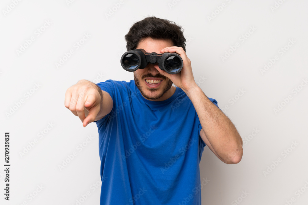 Handsome man with black binoculars Handsome man with black binoculars