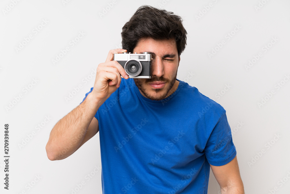 Handsome man holding a camera Handsome man holding a camera