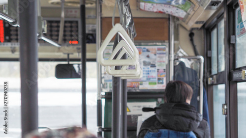 Handles for standing passenger inside a bus.