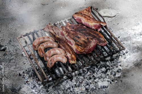 Meat on the grill at the forest, Ushuaia, Argentina