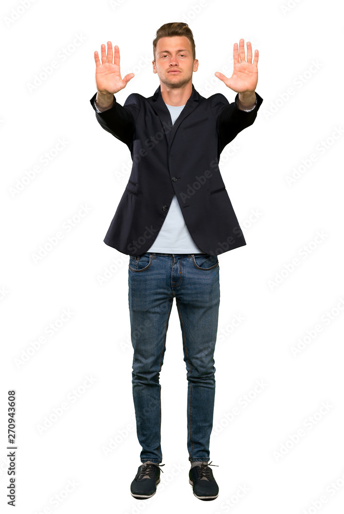 Blonde handsome man making stop gesture and disappointed Blonde handsome man making stop gesture and disappointed