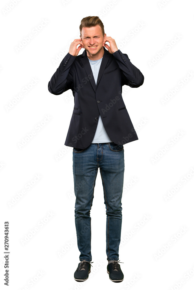 Blonde handsome man frustrated and covering ears Blonde handsome man frustrated and covering ears