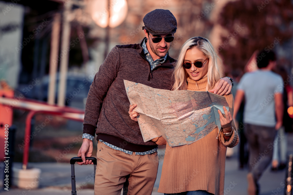 Couple of tourist using map