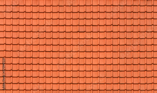 New orange tiles on the roof of the building