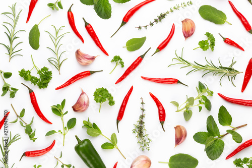 Spice herbal leaves and chili pepper on white background. Vegetables pattern. Floral and vegetables on white background. Top view  flat lay.